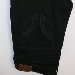 Distressed black Hollister skinny jeans